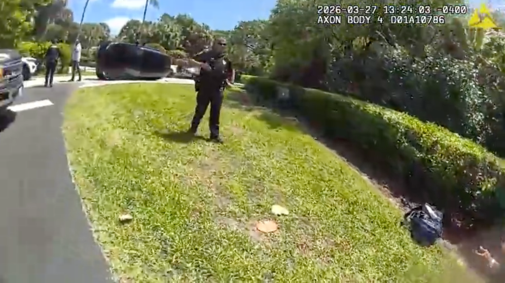 Newly-released Tiger Woods bodycam footage shows golfer crouching on side of road after DUI crash