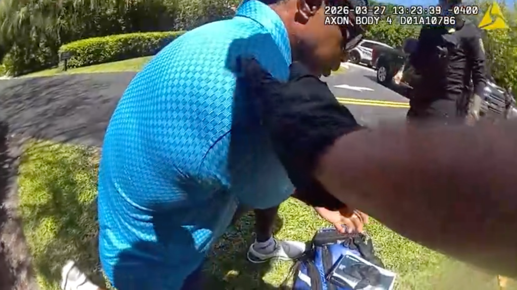 Newly-released Tiger Woods bodycam footage shows golfer crouching on side of road after DUI crash